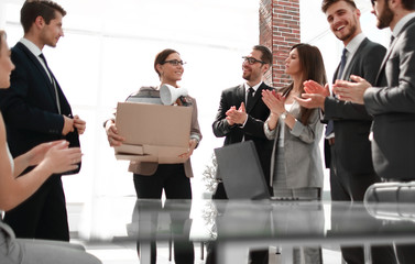 business team applauds the new employee on the first working day