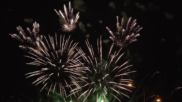 Colorful fireworks at holiday night in slow motion.