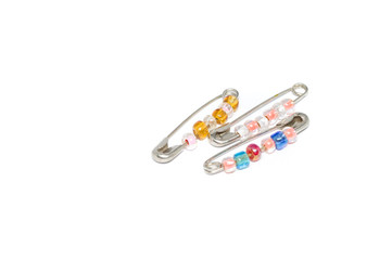 pin brooch with beads, isolated in white background