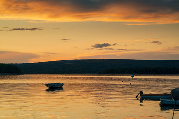 Fototapeta premium Boat at sunset in Adriatic sea