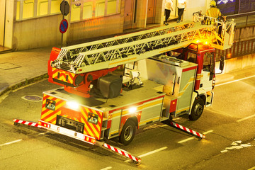 fire truck firetruck in street city at night