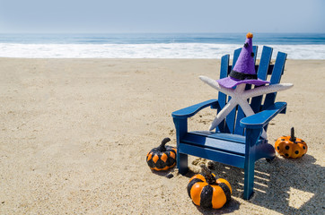 Halloween background on the beach with starfishes in witch's hats