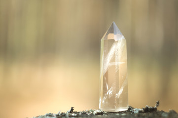 Large clear pure transparent great royal crystal of quartz chalcedony diamond brilliant on nature blurred bokeh background close up