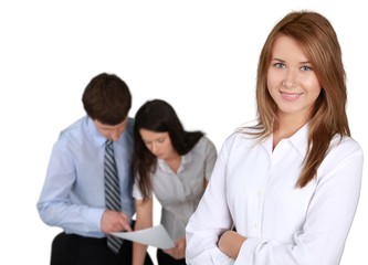 Obraz premium Friendly Businesswoman and Talking Collaborators in Background -