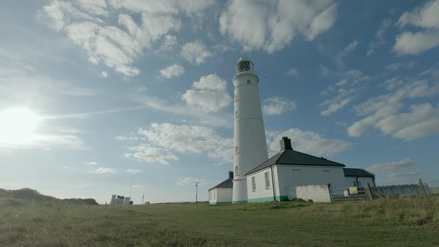 Drone footage filmed at Nash Point lighthouse during a sunset. Would make a great establishing shot