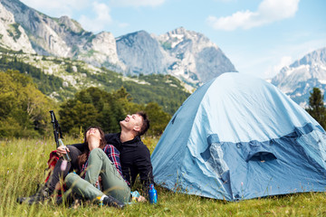 Couple enjoying at camping in the nature