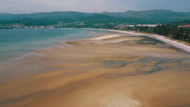 Aerial view of Boiro bay. Here you can see the beach, marshes of a river and in the background the village. A paradise located in Galicia, Spain.