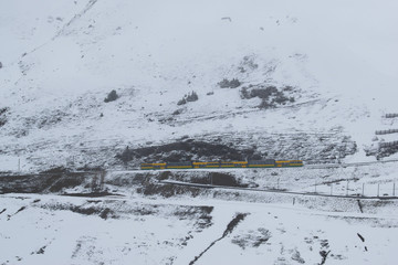 yellow_train_in_snow_-1