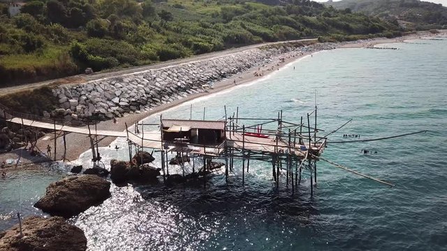 Trabocchi are a massive coastal fishing construction built from wood, which consists of a platform anchored to the rock by large logs jutting out into the sea on the Adriatic sea in Italy.