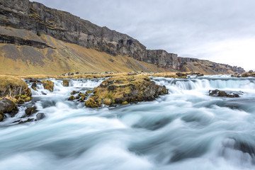 A slow exposure of a river in Iceland in a cloud, overcast day