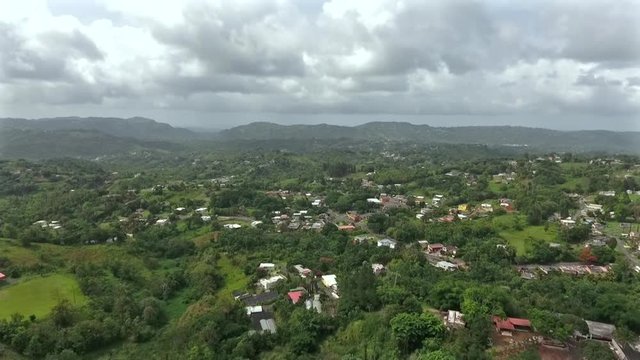 Flying drone above the houses and trees in Community The "Corujas"