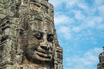 Fototapeta na wymiar The mystery face towers in Bayon temple, temple of King Jayavarman VII. The faces were believed to represent Brahma, the Hindu God of creation but some believe that it is the King himself.