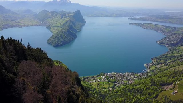 Epic aerial shot of a peaceful village at the edge of the water