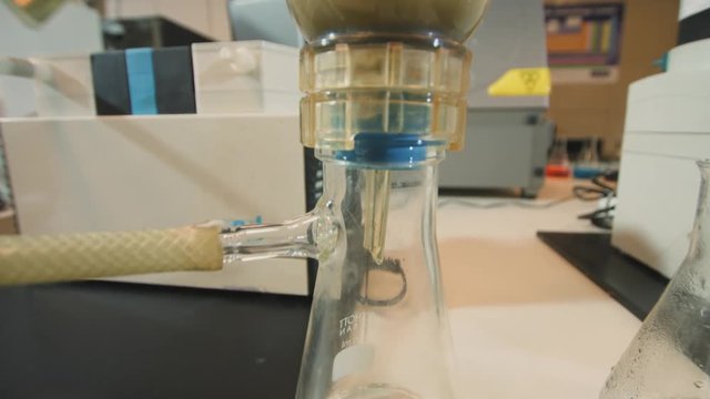 Chemical engineering - 3 clips. Laboratory equipment working in chemistry lab. Tilt Down, Tilt Up, Fast Pan Left, chemical experiment in laboratory for cement testing. 4K footage