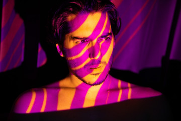 Cinematic portrait of man in yellow and purple lines, projecto