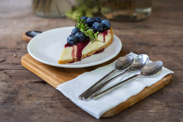 blueberry cheese cake on wooden table