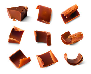 Realistic chocolate pieces and shavings. Vector illustration isolated on white background. Ready for your design. EPS10.
