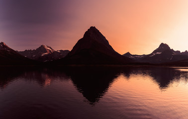 Fototapeta na wymiar Sunset over Swiftcurrent Lake, Glacier National Park, Montana