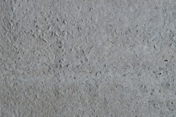 Gray cement wall texture, uneven surface with pattern, abstract background  
