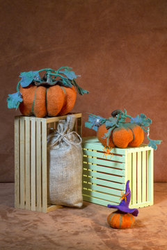 Still life with handmade pumpkins from felted wool for the celebration of Halloween