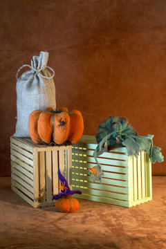 Still life with handmade pumpkins from felted wool for the celebration of Halloween