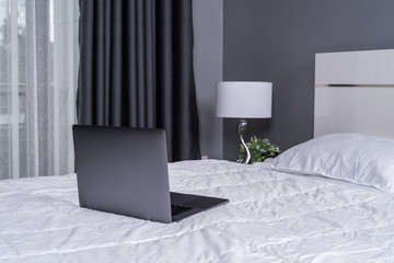 laptop computer on a bed