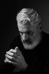 Portrait of man with grey hair in black and white