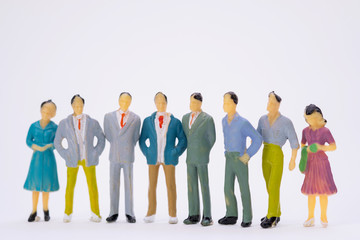 Group of figure miniature businessman or small people investor and office worker secretary on white background for money and financial business teamwork concept.