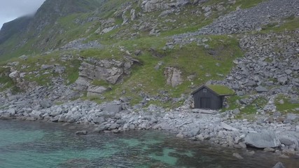 Dron closin in to the wooden boat garage at the seashore 4k, 30fps