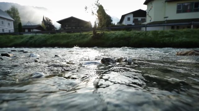 little stream in austria village of kleinarl