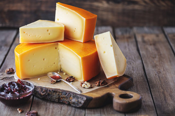 fresh cheese on wooden cutting board