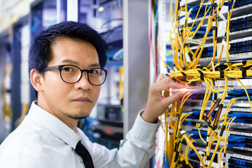 handsome business man engeneer in datacenter server room