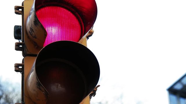 Close-Up Of Red Light On Traffic Light. Yellow to Red. Zoom In..