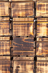 Background of many handmade burned wooden boxes