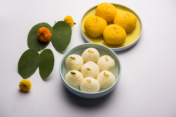 Happy Dussehra / Vijayadashami / Ayudh Puja greeting card using apta/Bauhinia racemosa/Bidi leaf and indian sweet Rasgulla for Navaratri