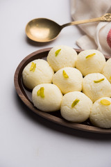 Indian Rasgulla or Rosogulla dessert/sweet served in a bowl. selective focus