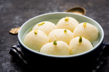 Indian Rasgulla or Rosogulla dessert/sweet served in a bowl. selective focus
