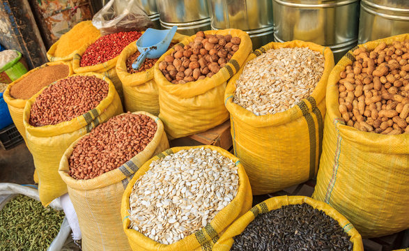 Seeds and nuts in canvas bags at the traditional souk market in the old town or medina of Fes Morocco