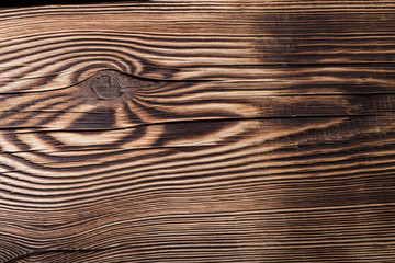 An old board with knots and chips. Wood. Background. Selective focus