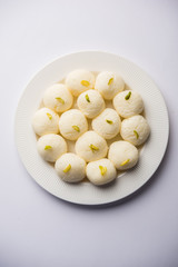 Indian Rasgulla or Rosogulla dessert/sweet served in a bowl. selective focus