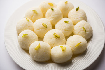 Indian Rasgulla or Rosogulla dessert/sweet served in a bowl. selective focus
