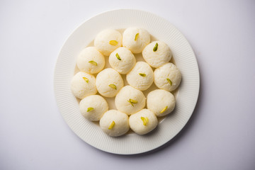 Indian Rasgulla or Rosogulla dessert/sweet served in a bowl. selective focus