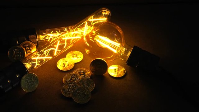 BTC among avid bulbs. The light flashes, an electrical short circuit. 4K, UHD, 50p, Cinematic,Closeup, Shallow depth of fields.