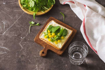 Perfect gourmet appetizer. Toast bread with green salads on top. Bread, vegetable and fruit. Diet concept.