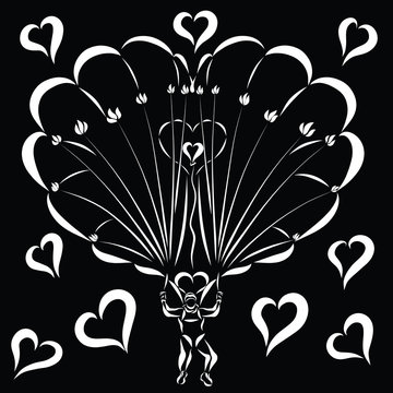 A man descending on a parachute in the shape of a heart with flowers