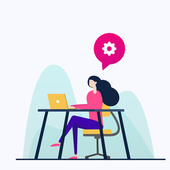 woman sitting at the table and working