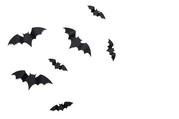 halloween and decoration concept - paper bats flying