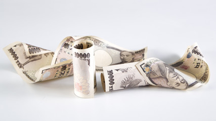 Japanese Yen bills on white