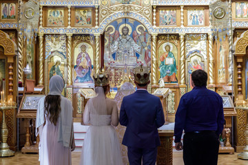 Traditional Russian Wedding Ceremony in Eastern Orthodox Church. San Francisco, California, USA.
