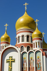 Exterior of the Holy Virgin Cathedral. View of the newly restored onion domes of the Russian...